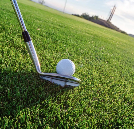 A golf ball with backspin created by a golf club